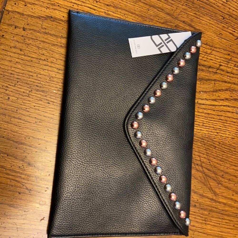 Black studded clutch